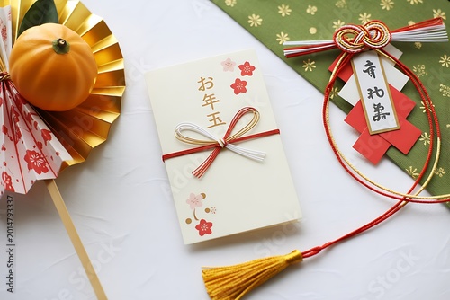 New year greeting card with traditional japanese decorations and autumn pumpkin