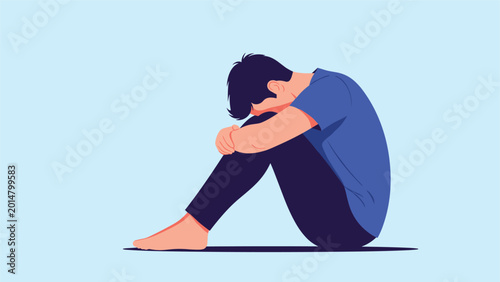 Depressed person sitting on floor with head down on knees expressing deep sadness loneliness emotional distress and mental health struggle.