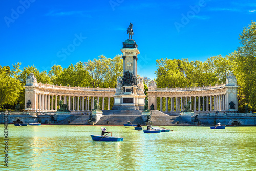 The Retiro Park in Madrid lake and Alfonso XII monument view