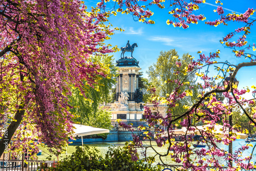 Madrid, Spain. Springtime flowers of Retiro Park in Madrid and Alfonso XII monument view