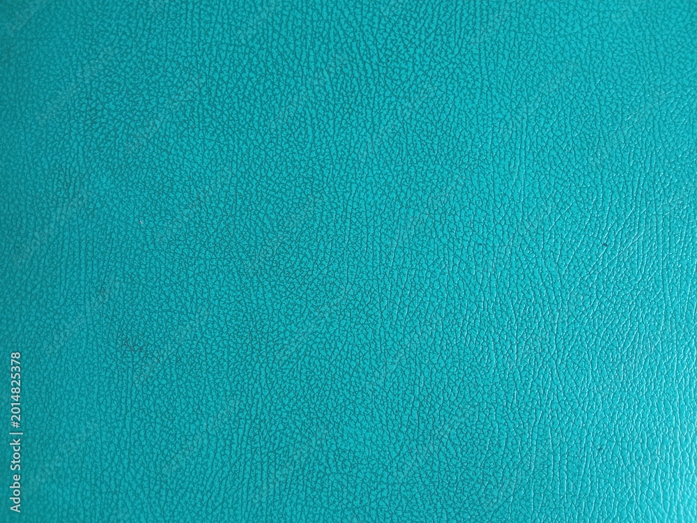 Fototapeta premium Close up blue synthetic leather texture with detailed grain pattern. Modern abstract background for design, wallpaper, and material concepts