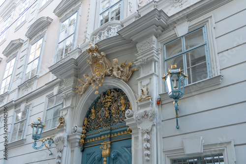 Vienna, Austria. Ornate baroque entrance with blue door and decorative lanterns