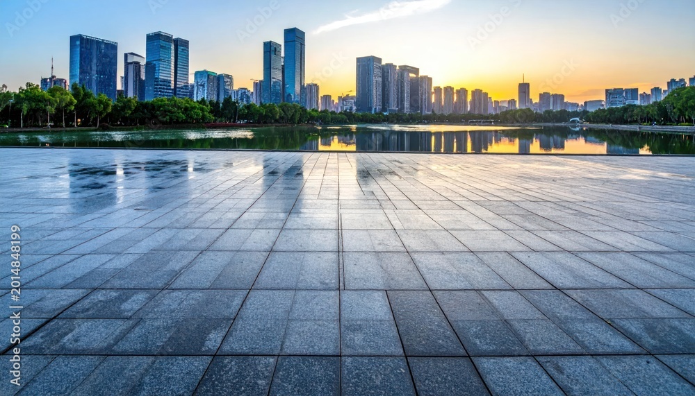 Obraz premium Urban Reflections - Cityscape Mirrored on Wet Pavement at Sunset.