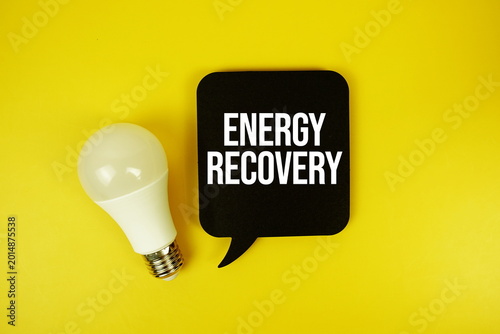 Slika na platnu Energy Recovery text with light bulb on yellow background