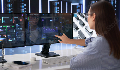Bild auf Leinwand Young IT Specialist Monitors Real-time Network Performance