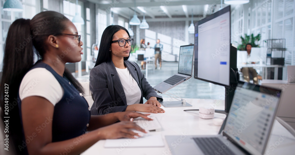 Naklejka premium IT Support Specialists Collaborate
