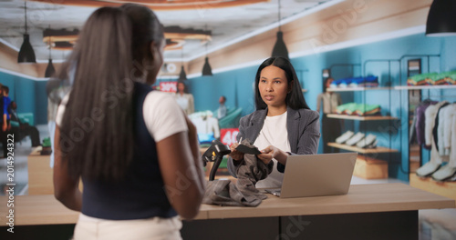Fotografie Store Manager Listens Carefully As Angry Customer Complains About Clothes