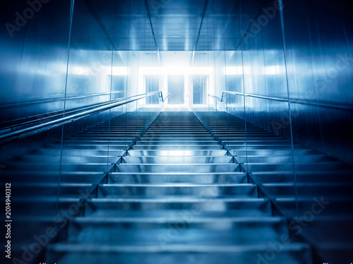 modern staircase leading to bright light