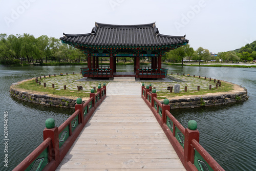 Symmetric Perspective of Empty Wooden Walkway at Gungnamji Pond