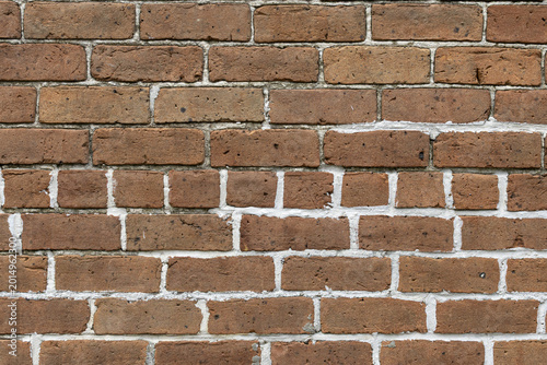 Old Brick Wall with Fresh Mortar Repairs and Weathered Texture