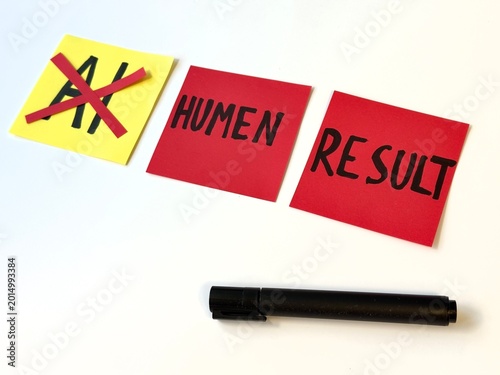 Photos Yellow sticky note shows crossed-out 'AI' symbol