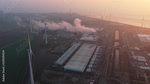 Aerial view of google data center and wind turbines at sunrise