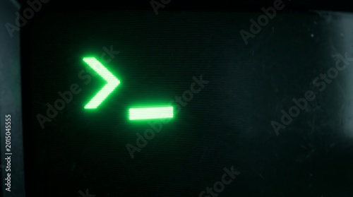 Green command line prompt on vintage computer monitor with glowing blinking cursor symbol.