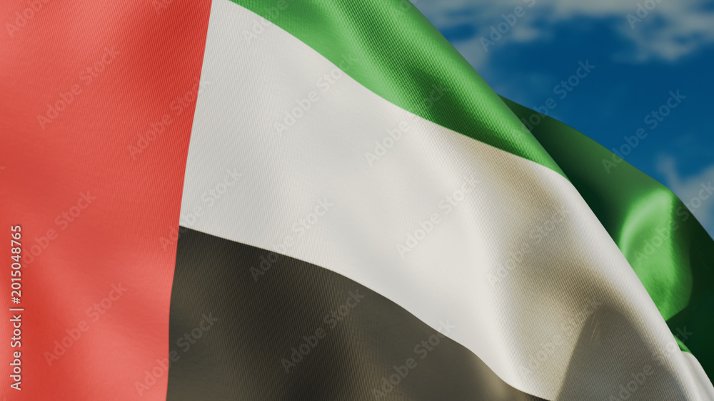 Fototapeta premium United Arab Emirates flag waving in wind close up, against the background of the sky with clouds, realistic render