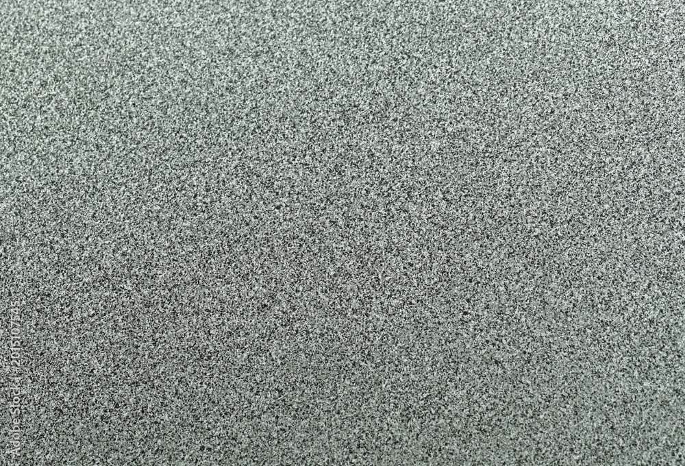 Fototapeta premium Terrazzo cement background with black and white stone grains scattered all over concrete floor