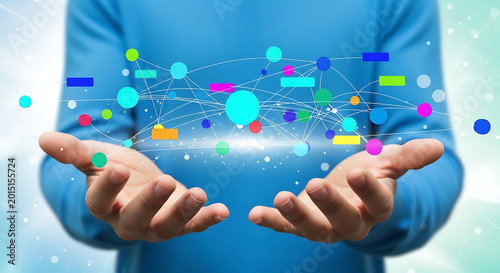 Person's Hands Gently Holding a Network of Glowing Abstract Shapes and Connections