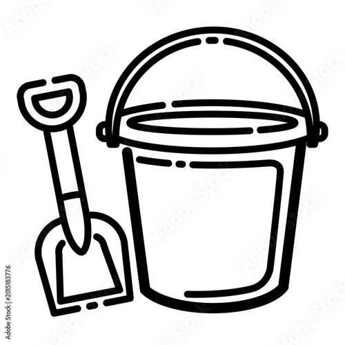 Bucket and shovel for playing sand on the beach