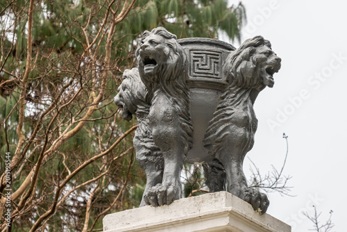 Valokuva Antique cast-iron flower pots in the Arboretum park in Sochi