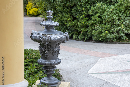 Quadro su tela Antique cast-iron flower pots in the Arboretum park in Sochi