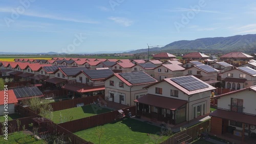 Sustainable Residential Neighborhood with Solar Panels on Roofs, Aerial Slow Ascend