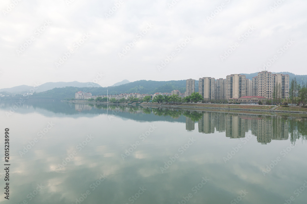 Fototapeta premium The city and its landscape in the morning mist and rain