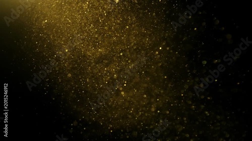 Golden Glitter Particles Floating in Slow Motion on Black