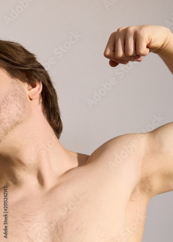 A man shows off his muscles, a real photo of people