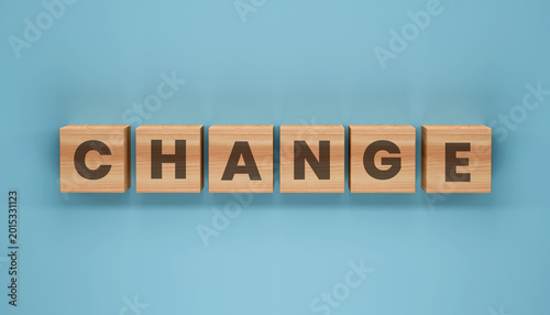 Photos Change Concept: Conceptual image showcasing the word CHANGE spelled out with wooden blocks, representing transformation and evolution in a simplified and visual way