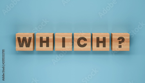 Photos The Question of Choice: The word WHICH is spelled out on individual wooden blocks, with a question mark, against a clean blue background, it is great representation of decision making process