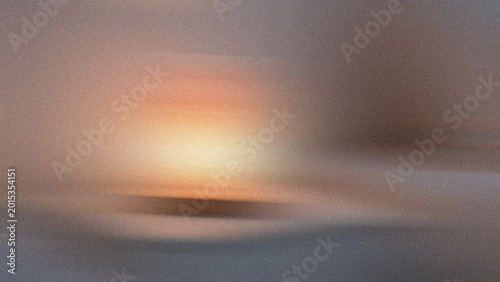 Sunset over a misty landscape with trees and hills