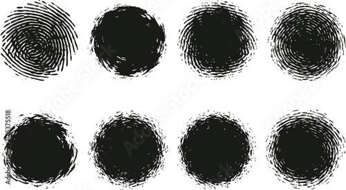 A collection of eight circular black grunge brush strokes isolated on a clean white background