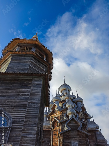 Valokuva A traditional wooden church with onion domes.