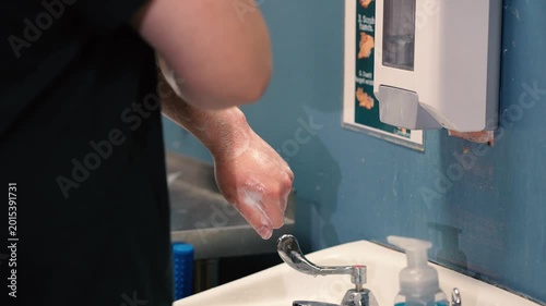Student Washes Hands at School