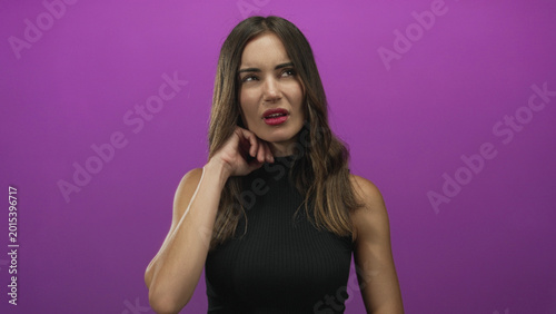 Bild auf Leinwand Woman holding neck in studio against vibrant purple backdrop with eyes closed in apparent pain and tense expression; discomfort