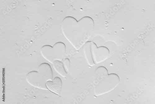 Minimal white embossed paper texture with decorative heart shapes, horizontal, embossed paper.