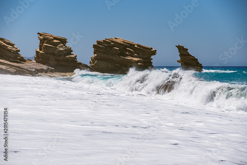 Billede på lærred Landscape with waves crashing against characteristic rocks on Triopetra Beach on