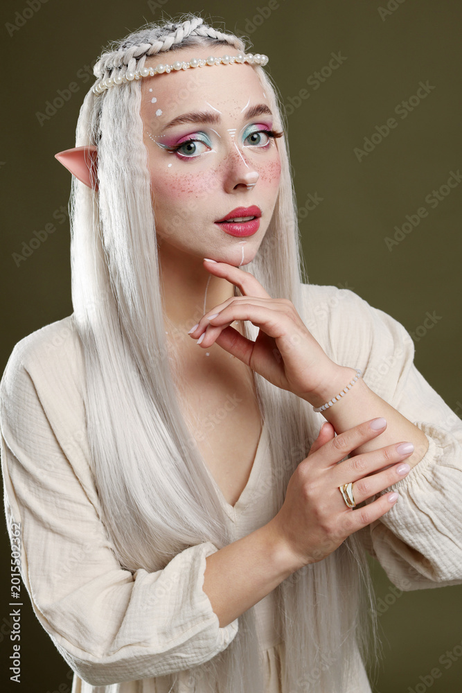 Naklejka premium Beautiful elf girl on dark olive background