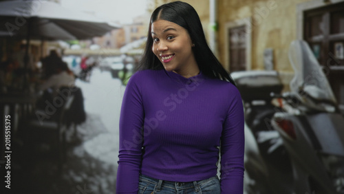 Obraz na płótnie Woman performs shoulder shrug wearing purple top on street terrace at casual sidewalk restaurant; uncertainty reflection