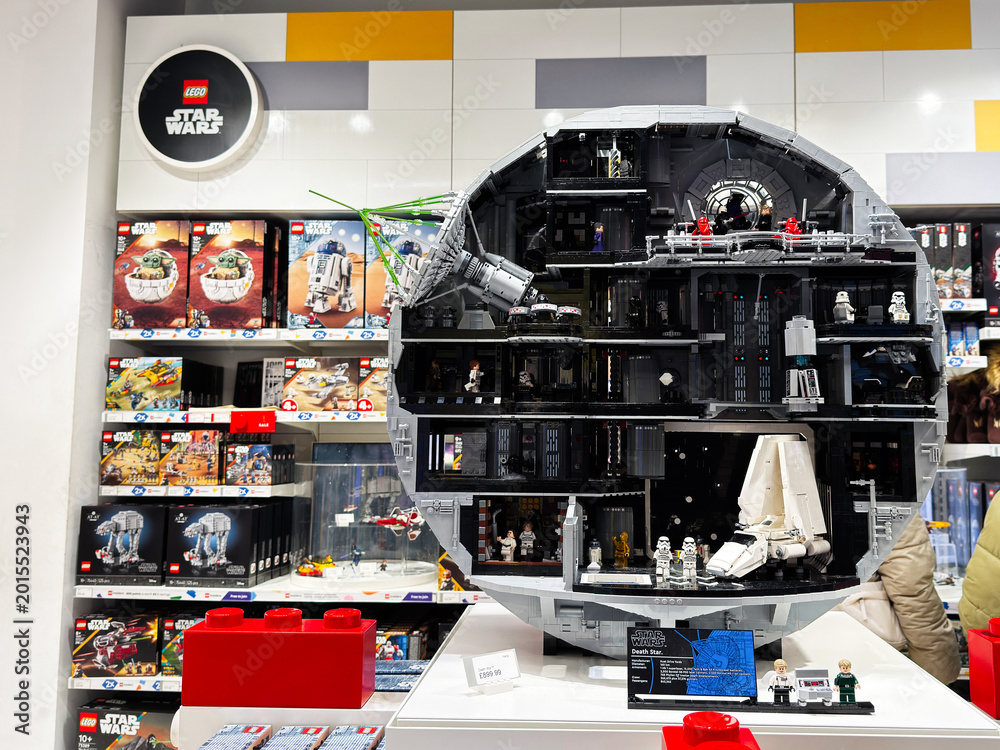 Fototapeta premium Lego Star Wars Death Star model display in a London UK toy store showcasing detailed minifigures, spacecraft and boxed sets in a large cutaway collectible exhibit