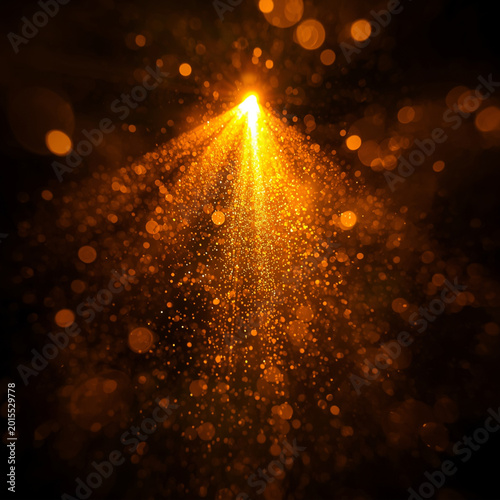 Abstract golden light rays and sparkling bokeh particles