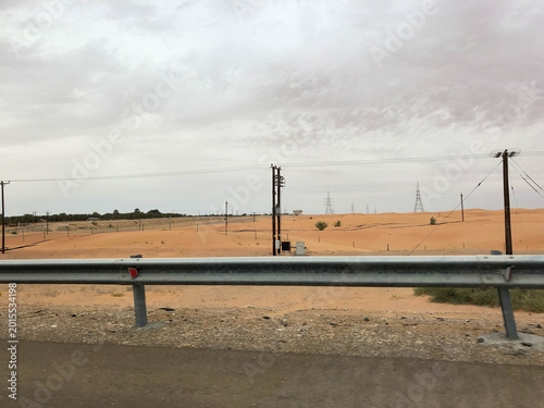 driving along the highway through the Arabian desert