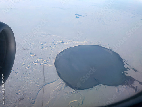 big lake in winter from airplane