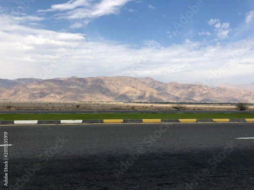 driving along the highway through the Arabian desert