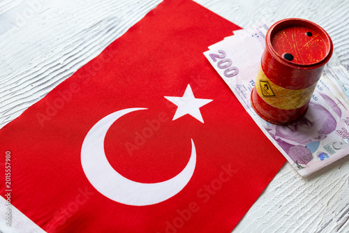 Miniature oil drum and Turkish Lira banknotes on Turkey flag