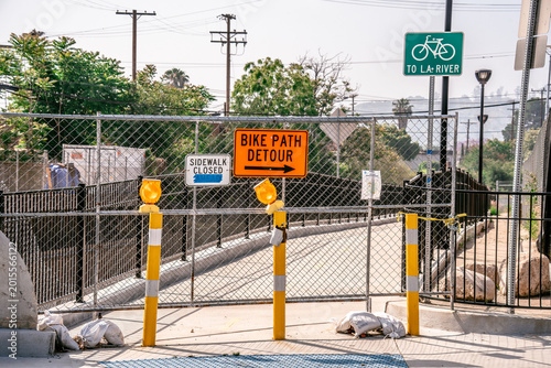 Photos Bike path and sidewalk closed due to construction, with detour signs and safety
