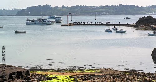 Brehat, France, May 1, 2026. Time-lapse video showing the harbor and boat activity on the island of Brehat in Brittany, France. Seaside landscape with a marina, tourists, and the tranquil atmosphere o