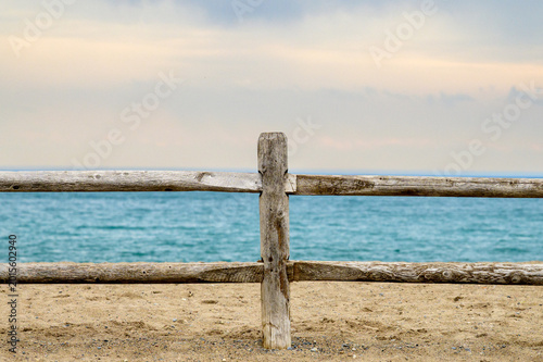 wood rail  fence on the beach room for text