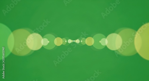 A row of green and yellow circles on a green background with white space