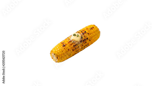 Fényképezés Food photography of grilled corn on the cob topped with melted butter and fresh herbs isolated on a clean white background