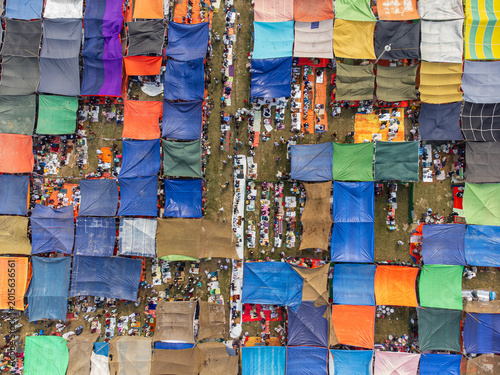 Tongi, Bangladesh - 31 January 2025: Aerial view of the Bishwa Ijtema gathering with thousands of people under colorful tarps and makeshift tents.